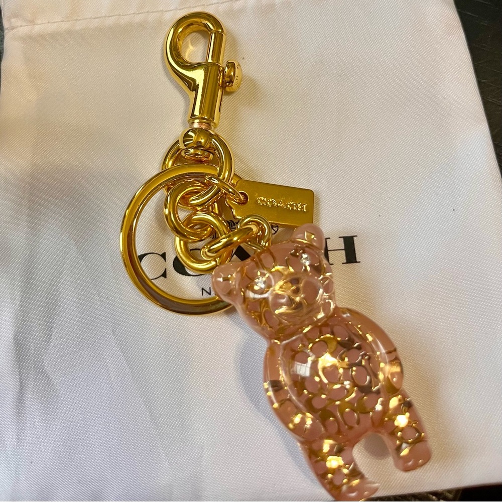 Coach pink and signature gold bear key /bag charm
